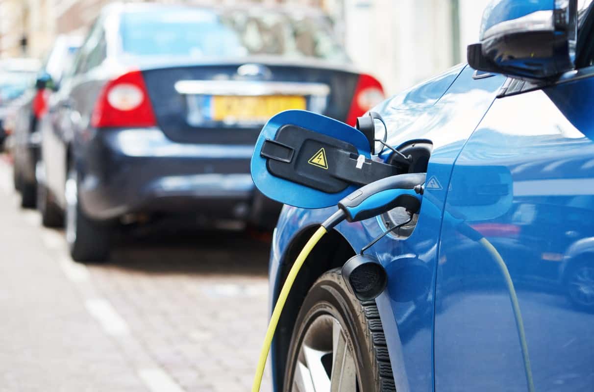 parked blue electric car charging